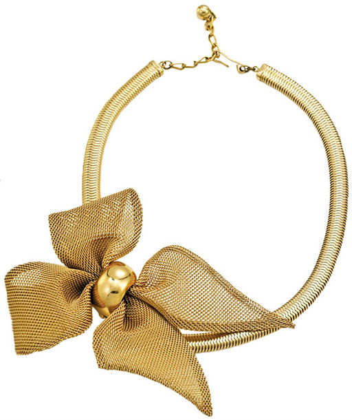 Napier introduced its "massive bows" in golden mesh in 1955. This one is connected to a gold-plated brass snake-chain choker with a gold-plated brass ring. (From "The Napier Company")